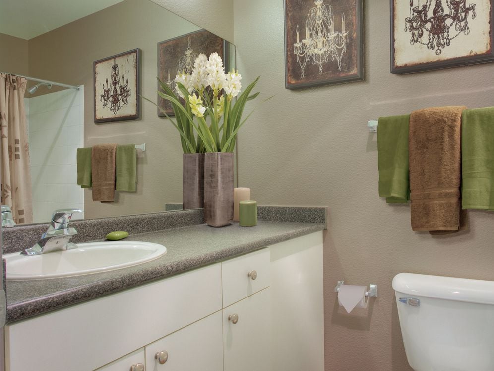 Classic Package II bath with laminate countertop, white cabinetry, and hard surface flooring