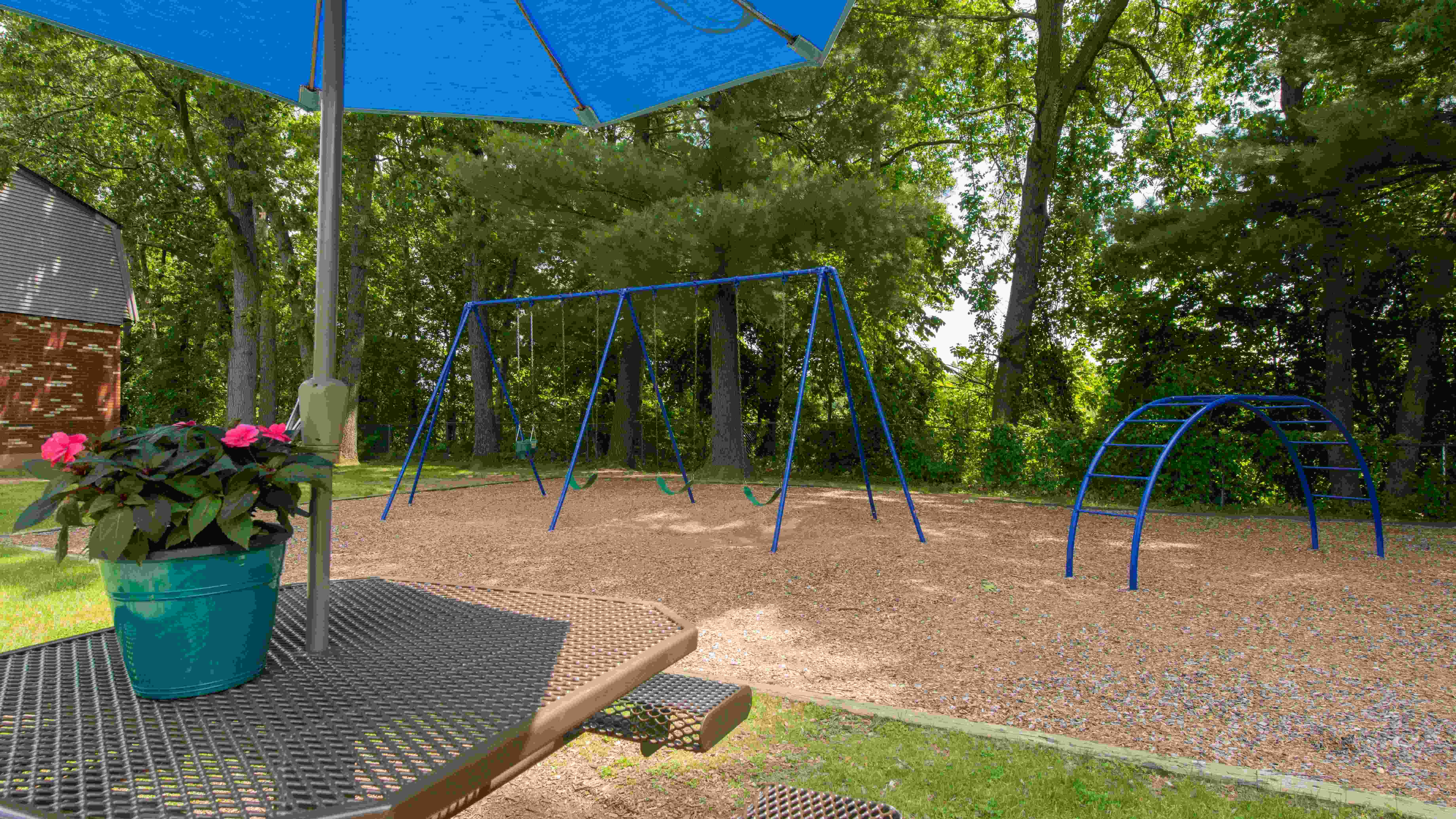 Our community offers a delightful picnic area with an umbrella-shaded table to relax, while kids can explore the on-site playground.