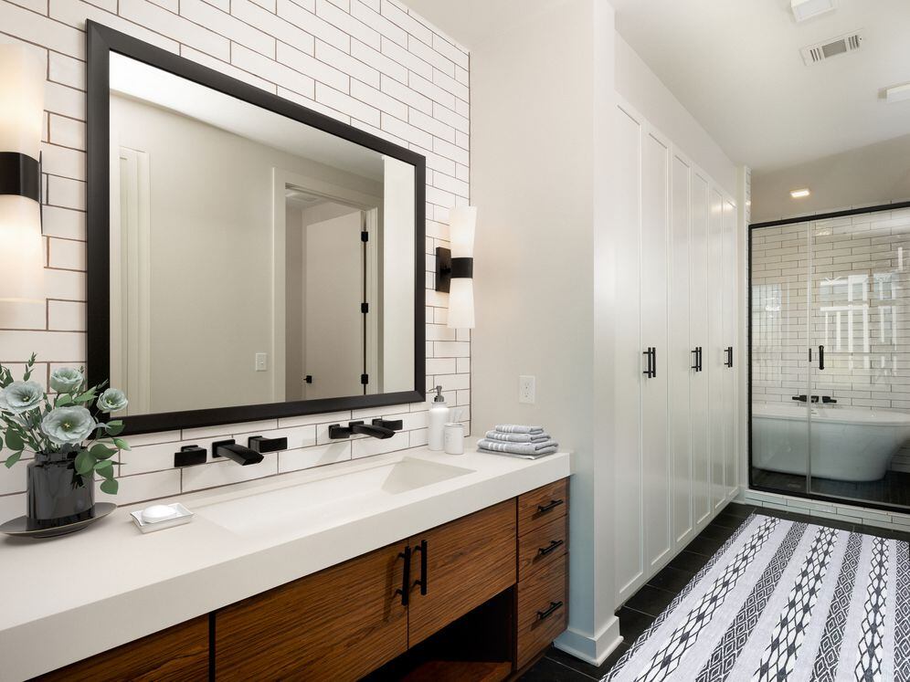 Bath with wood cabinetry, white quartz countertops, tile flooring, and extra storage