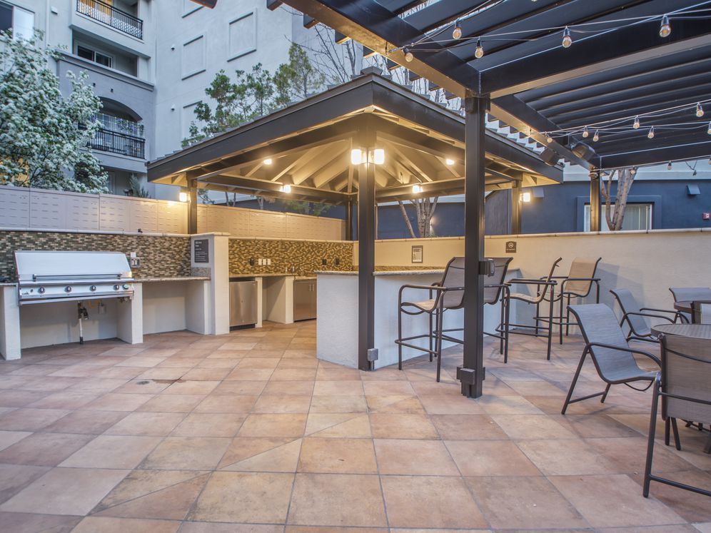 Outdoor kitchen with barbeque grills and picnic seating