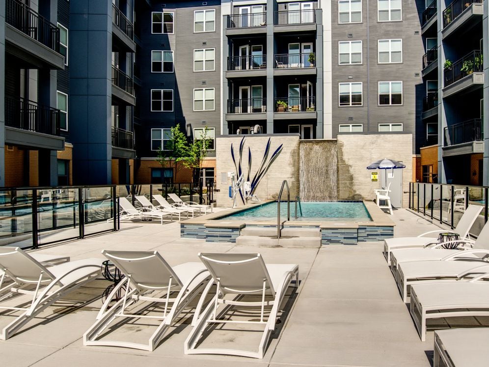 Courtyard with swimming pool, sundeck and lounge seating