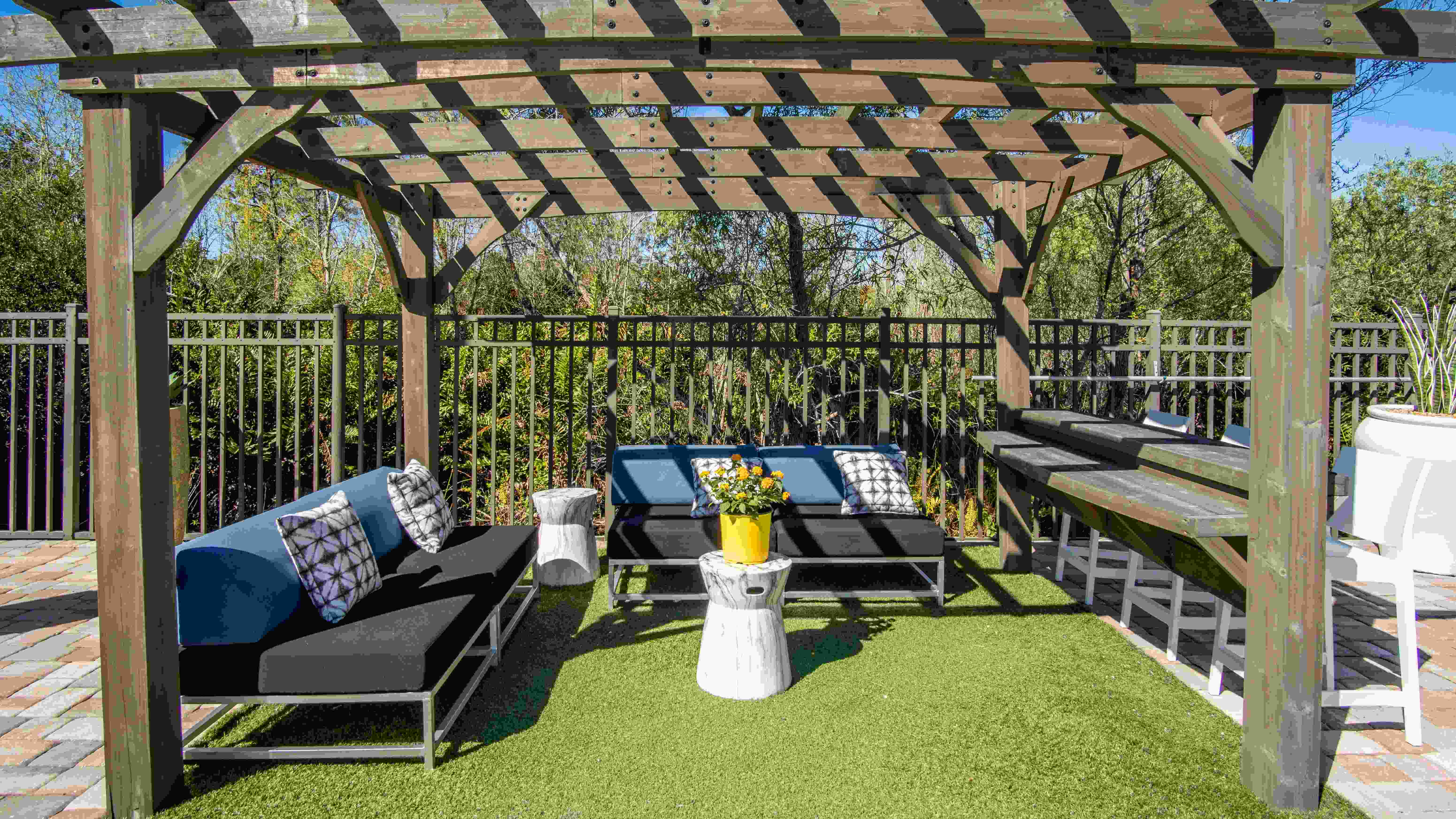 Unwind in shaded comfort under one of our inviting poolside pergolas, offering a luxe escape for relaxation. 