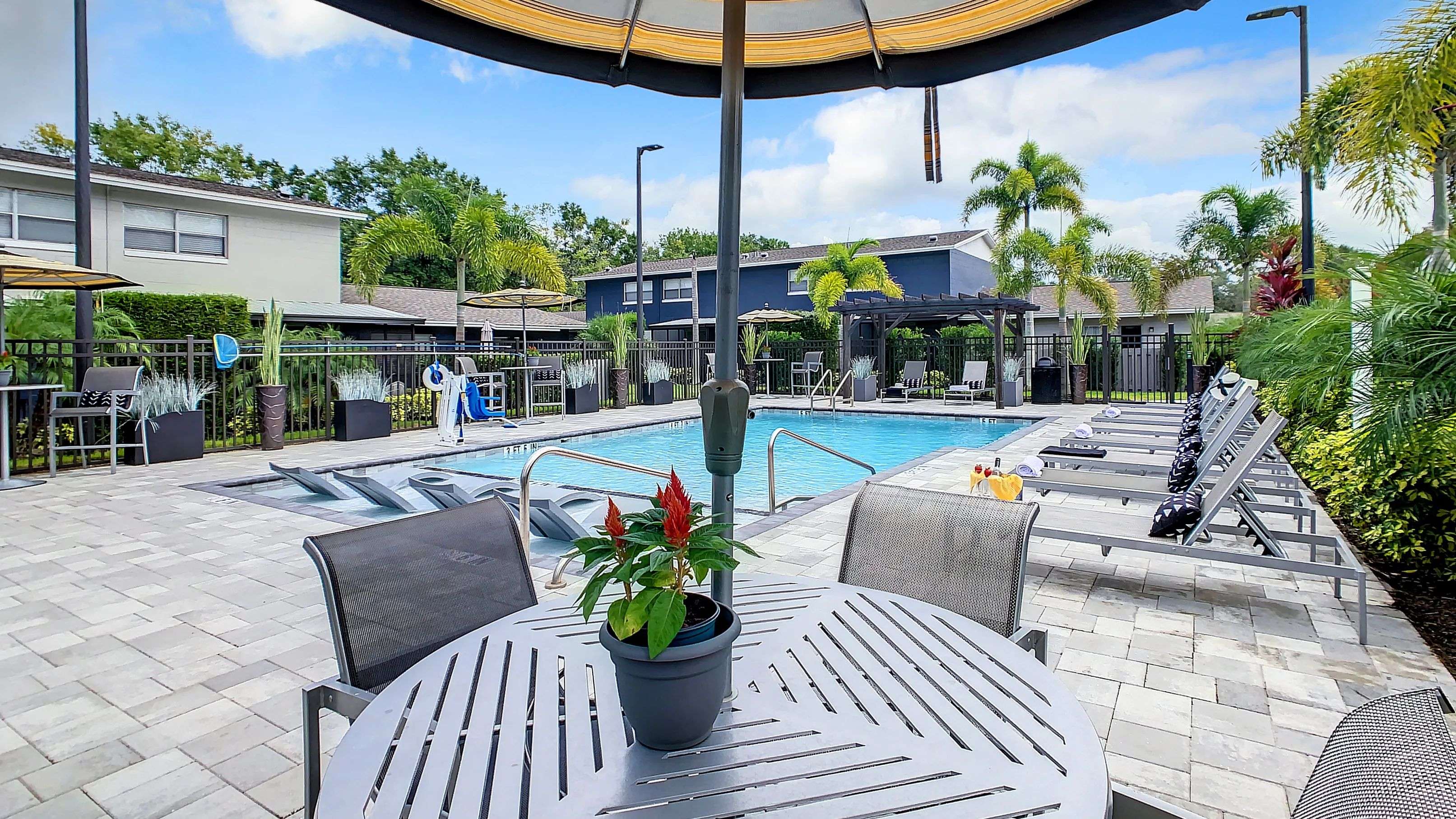 Our expansive sundeck features poolside seating all around for an enjoyable setting.