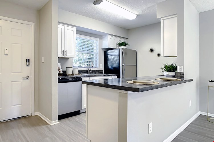 Select floor plans feature kitchens with spacious, open breakfast bars - a host's dream for gatherings and good times.