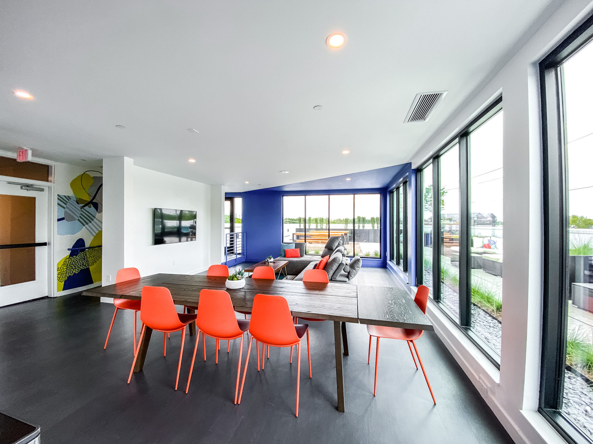 Community lounge on the 4th floor overlooking the rooftop