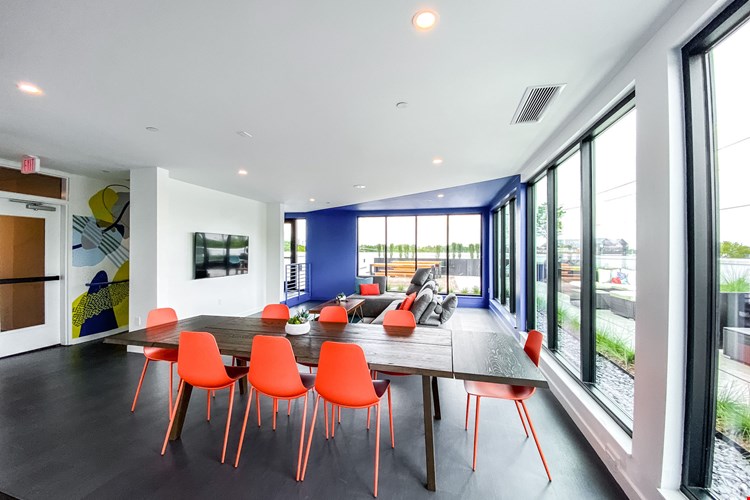 Community lounge on the 4th floor overlooking the rooftop