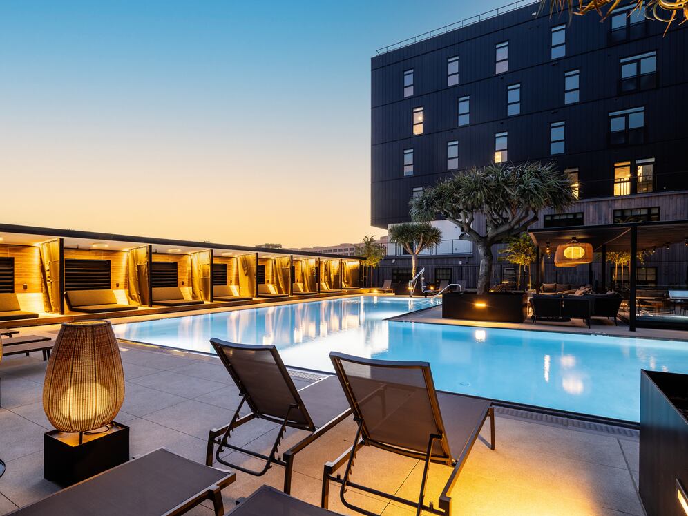 Pool and sundeck with cabanas