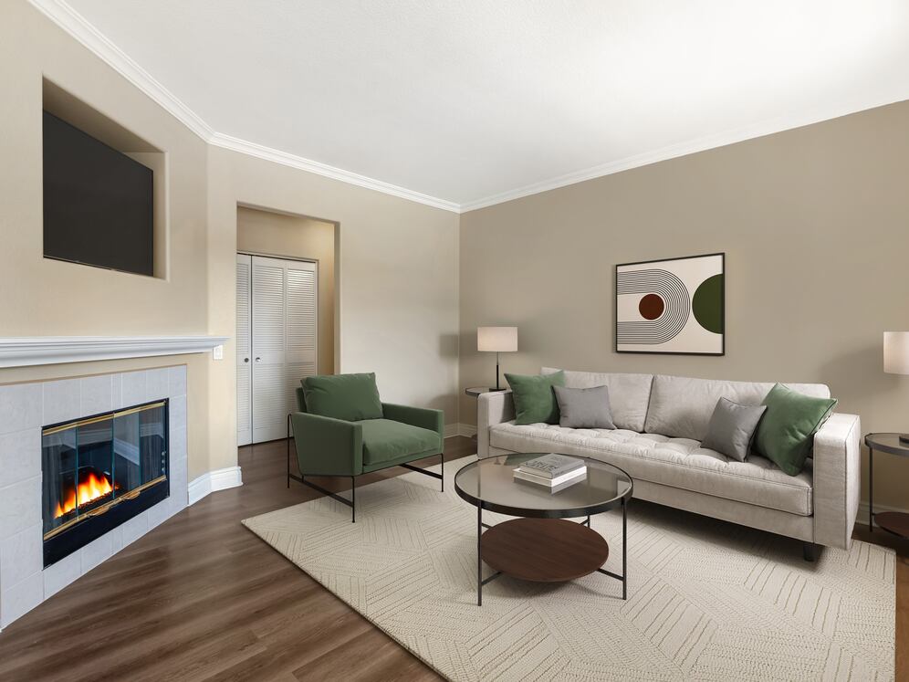 Updated Finishes living room with fireplace and upgraded hard surface flooring