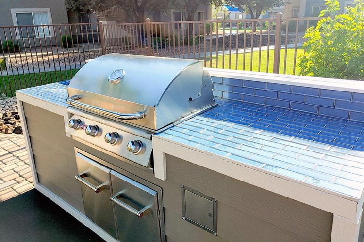 Our poolside picnic area features a gas grill.