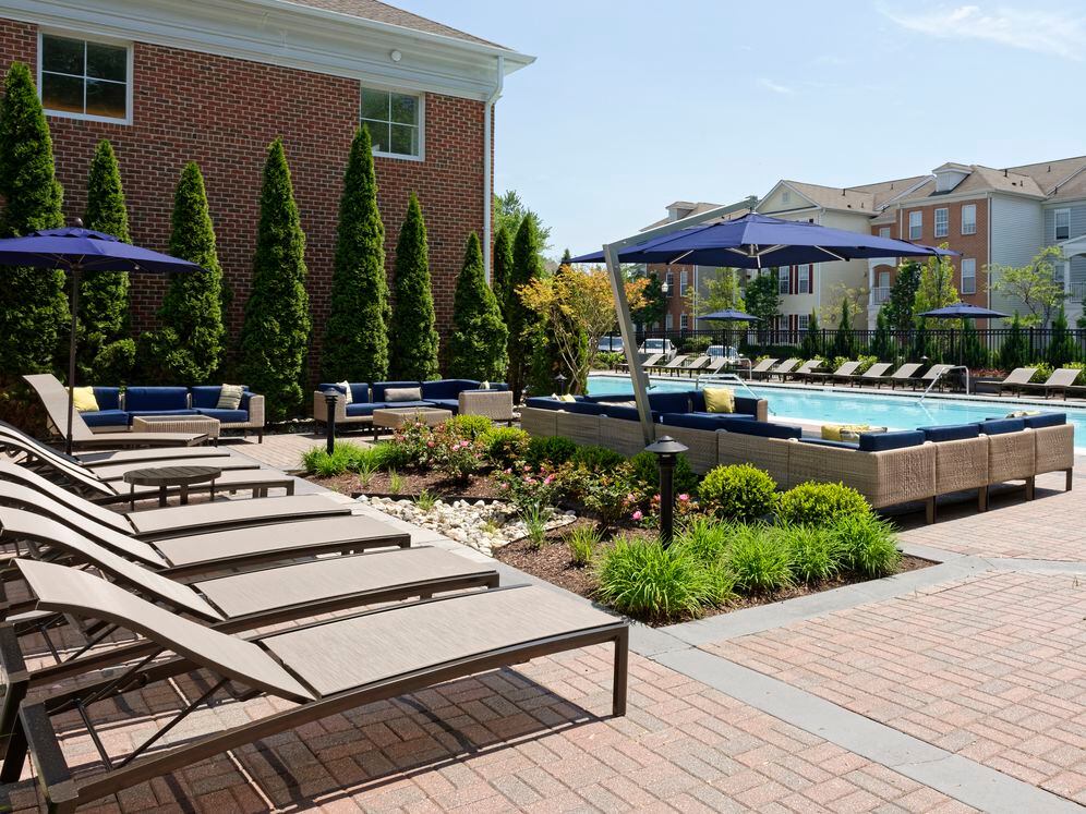 Pool and sundeck with lounge seating