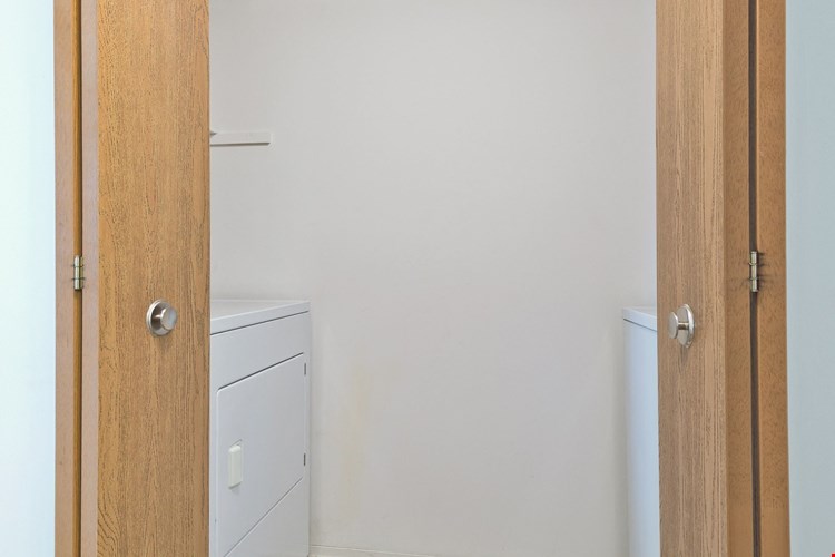 Full-size washer/dryer closet at Lakeside Village Apartments Clinton Township MI