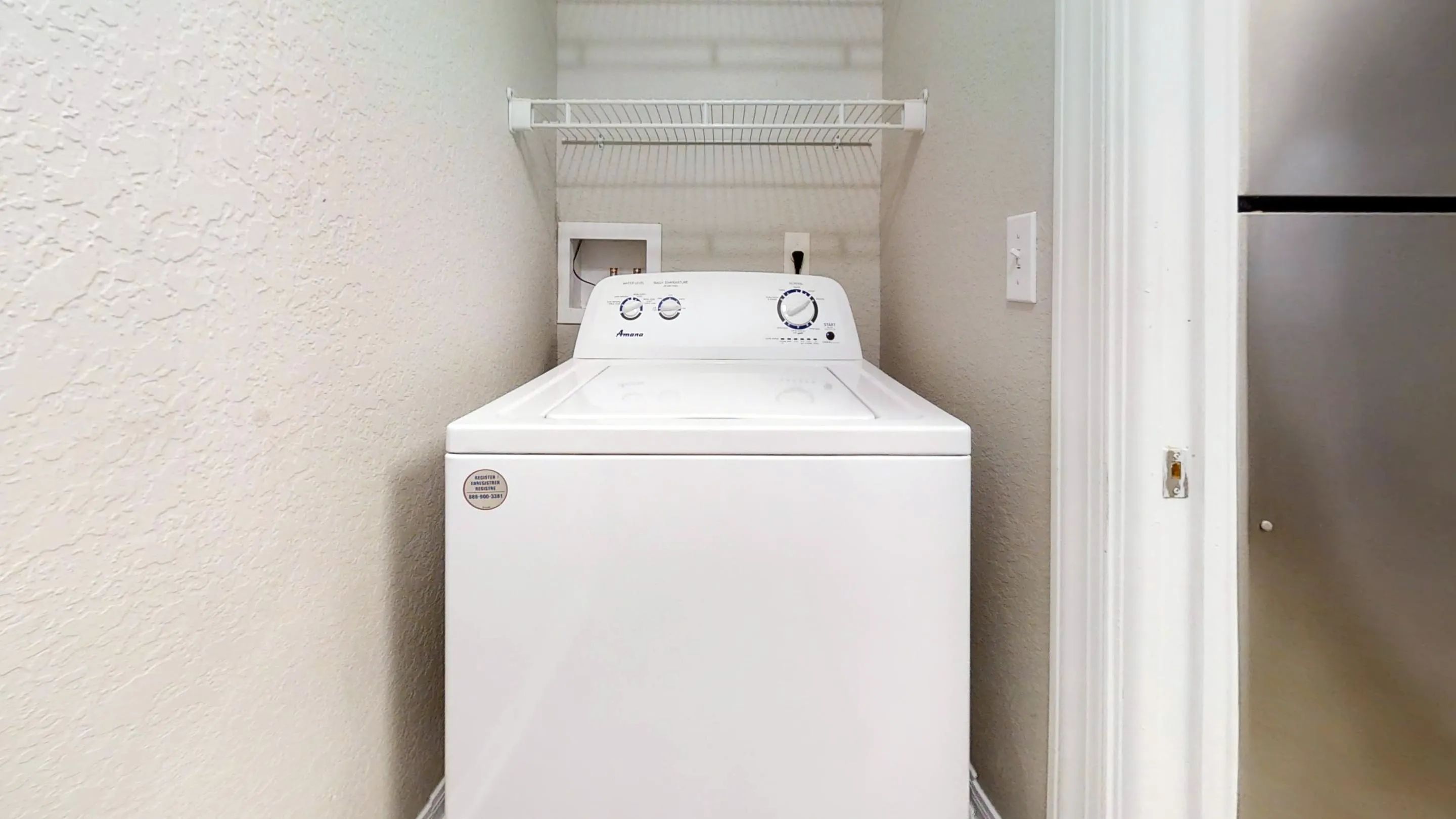 The Chateau offers a private laundry nook equipped with a full-size washer and dryer and built-in shelving to keep your space organized and efficient.