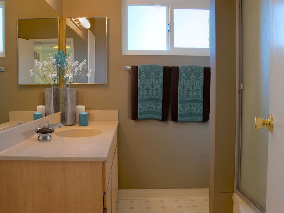 Classic Package I bath with oak cabinetry, white laminate countertops, and hard surface flooring