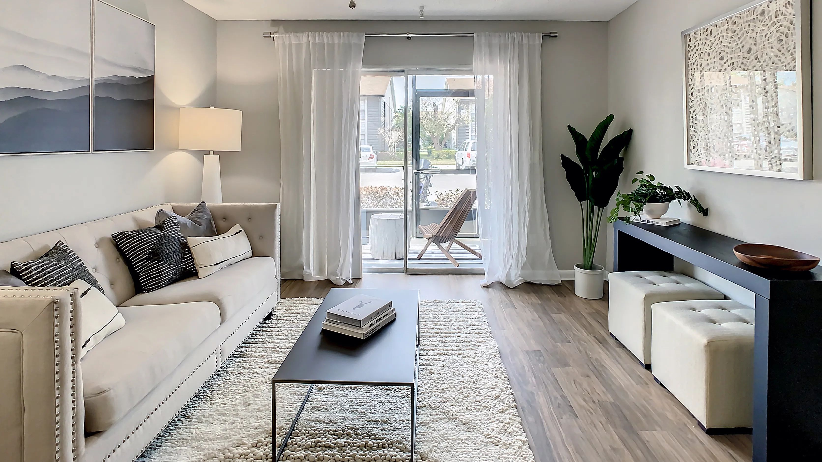 Unwind in our spacious living rooms with ceiling fans and private patio access.