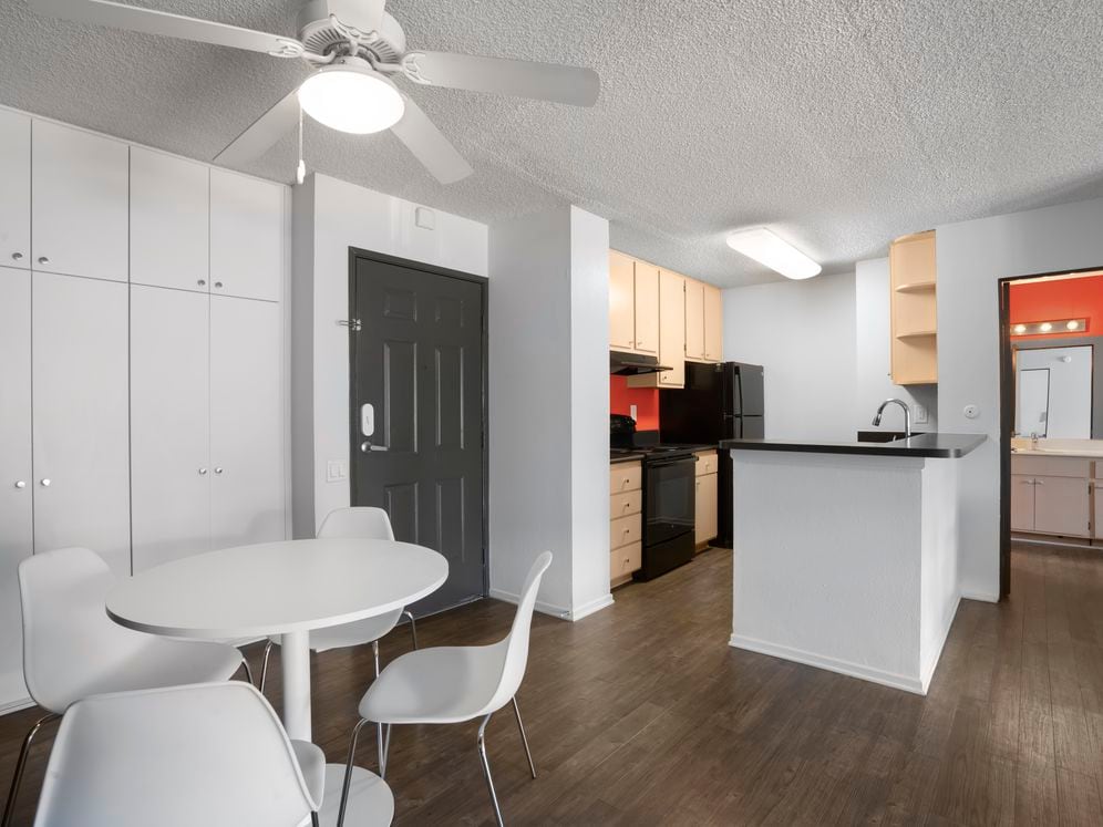 Furnished+ apartment homes include a dining set (Representative Image – exact items and style of furnishings may vary)