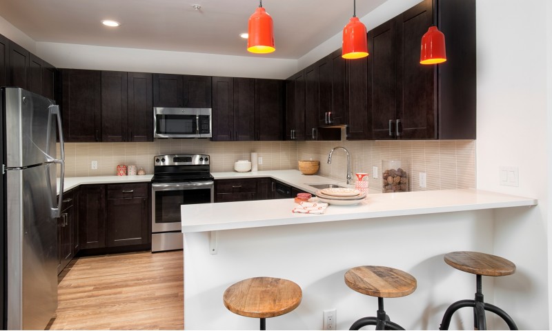 All-wood cabinets and tiled backsplash