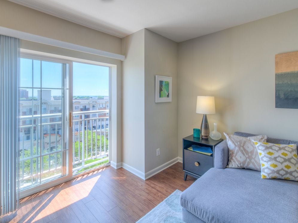 Living area with hard surface flooring and Juliette balcony