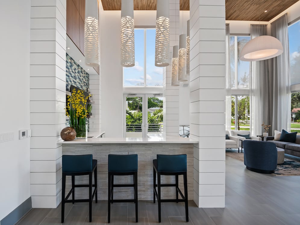 Lounge with multiple seating areas and kitchenette