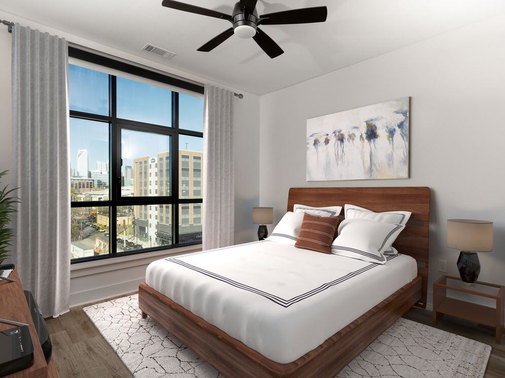 Bedroom with hard surface flooring, ceiling fan, and floor-to-ceiling window