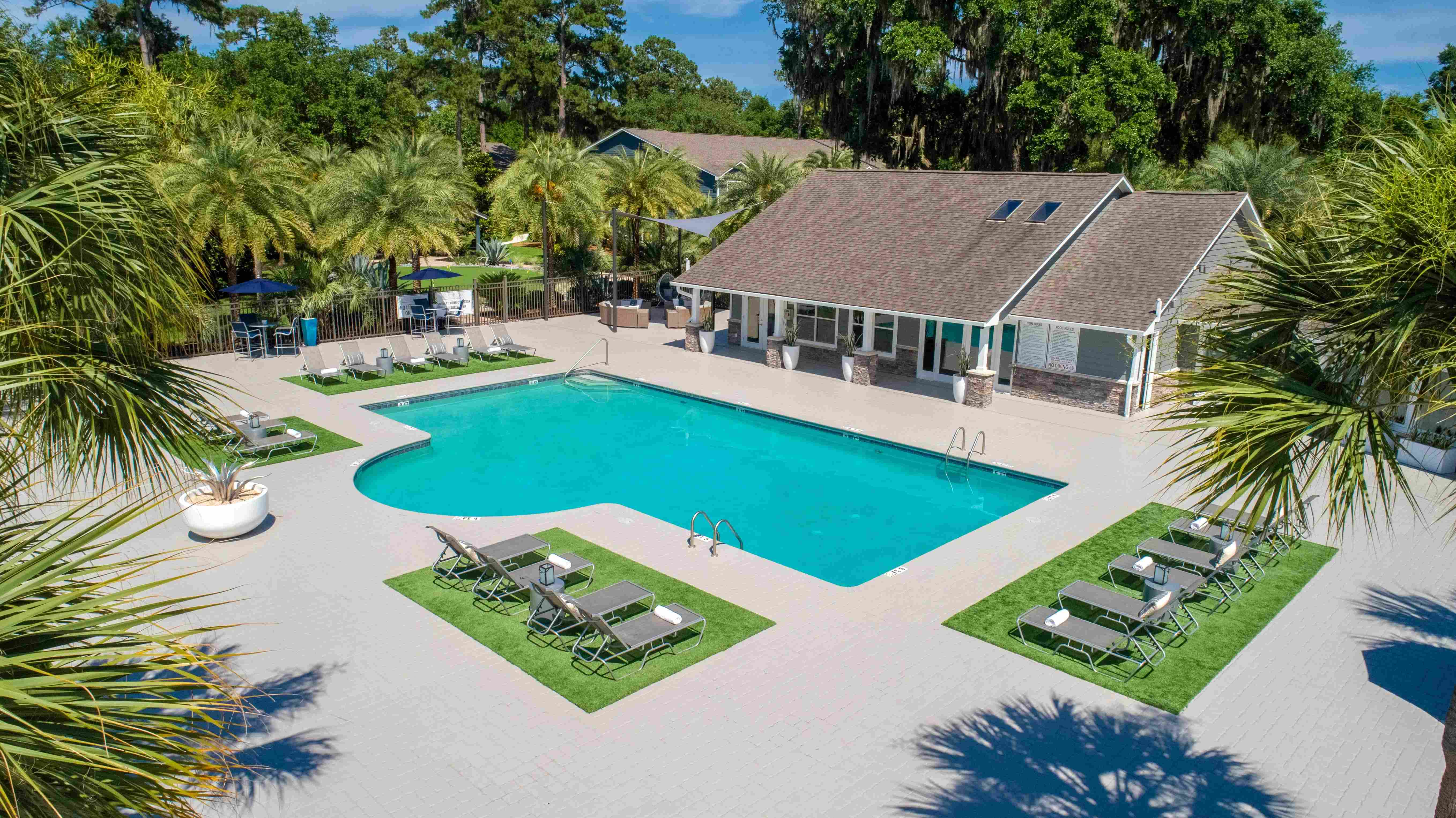 Immerse yourself in relaxation and luxury amidst the sparkling blue waters and sun-kissed loungers at our resort-style pool deck.