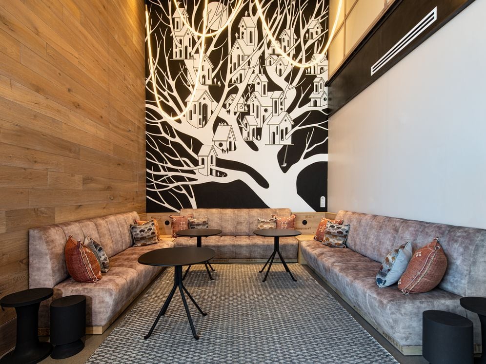 Lounge space with mural art by Drew Button