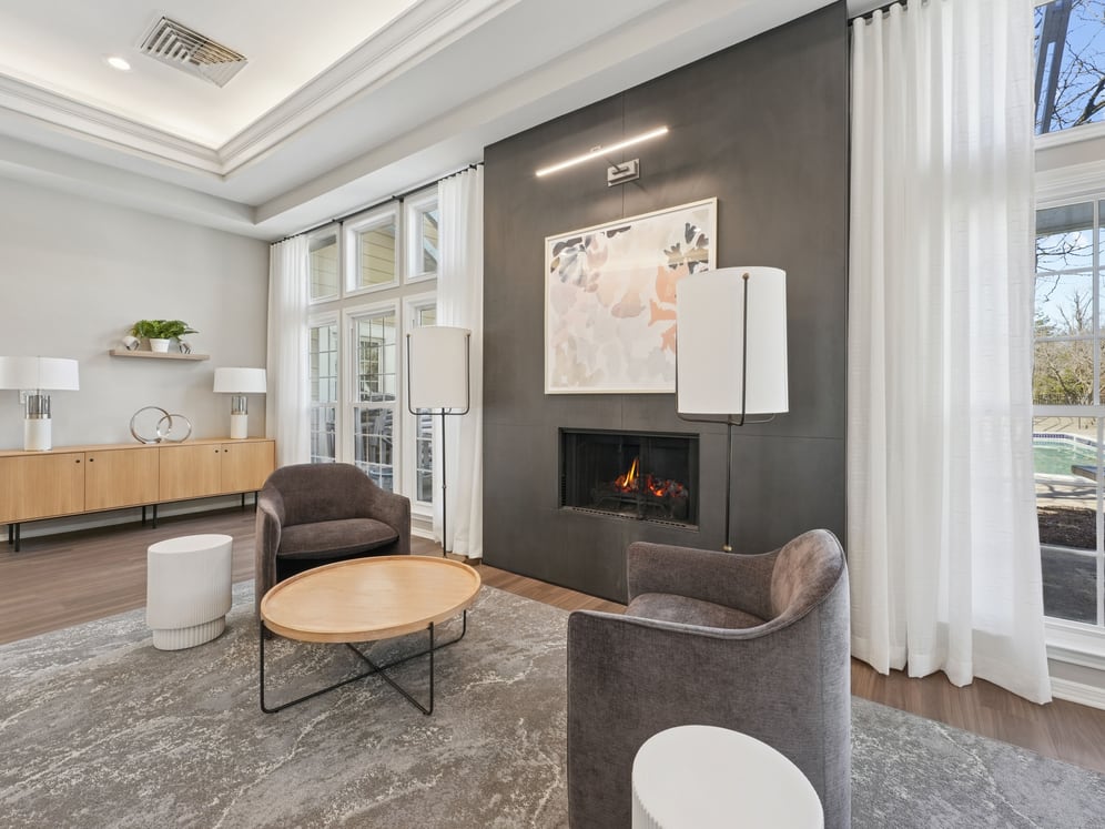 Resident lounge with fireplace and seating