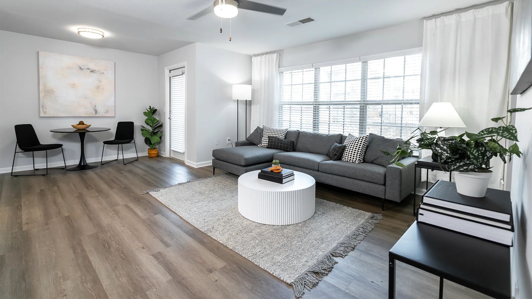 Immerse yourself in boundless delight within our expansive living rooms and bask in the abundant natural light that pours through a wall of sunlit windows. Embrace the joy and elevate your living experience at Market 1900. 