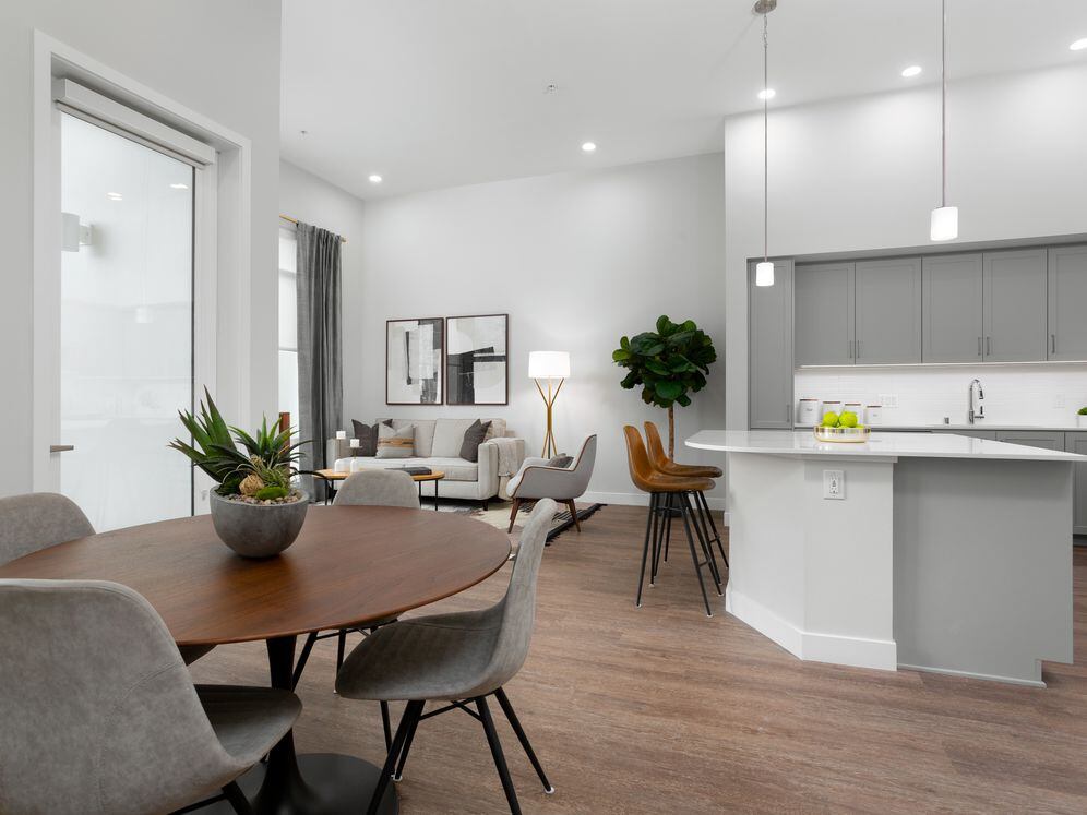 Apartments with hard surface flooring in kitchen, living, and dining areas