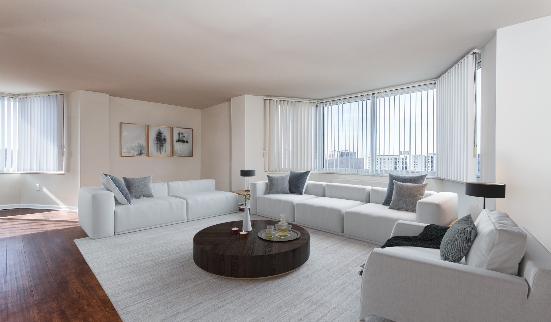 Large living area with hard wood flooring