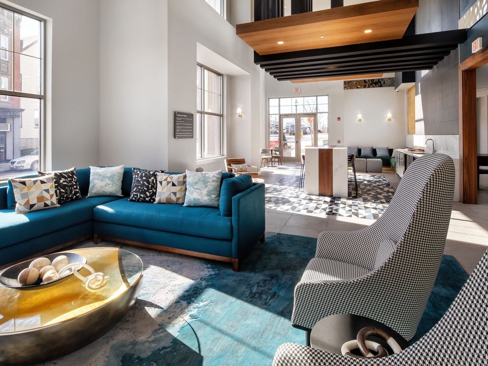 Resident lounge with seating and entertaining kitchen