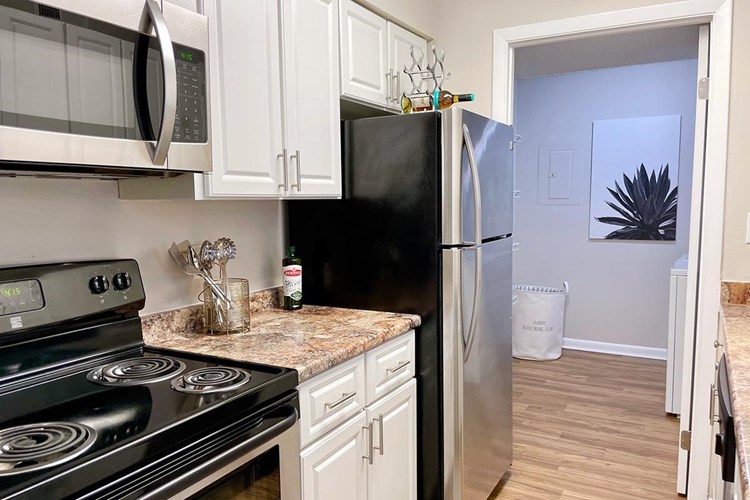 Beautiful stainless steel appliances and marble style countertops included in every kitchen.