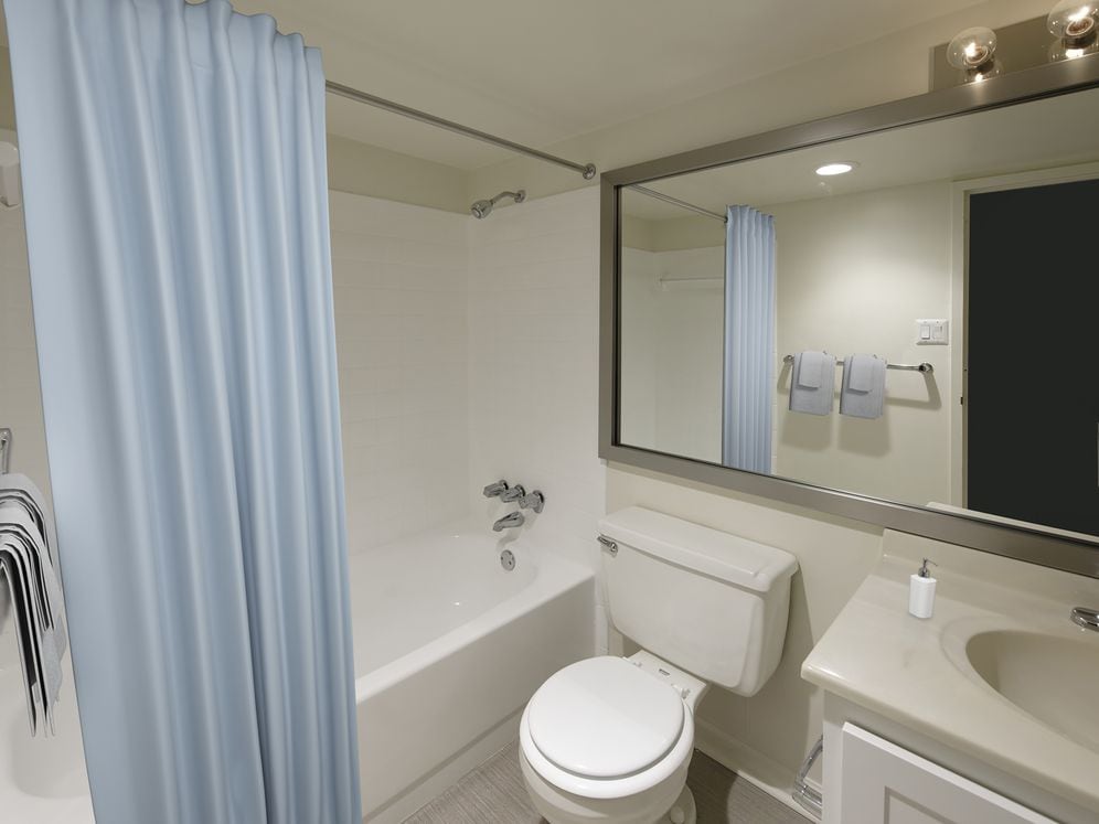 Finish Package III bathroom with white countertop and cabinetry