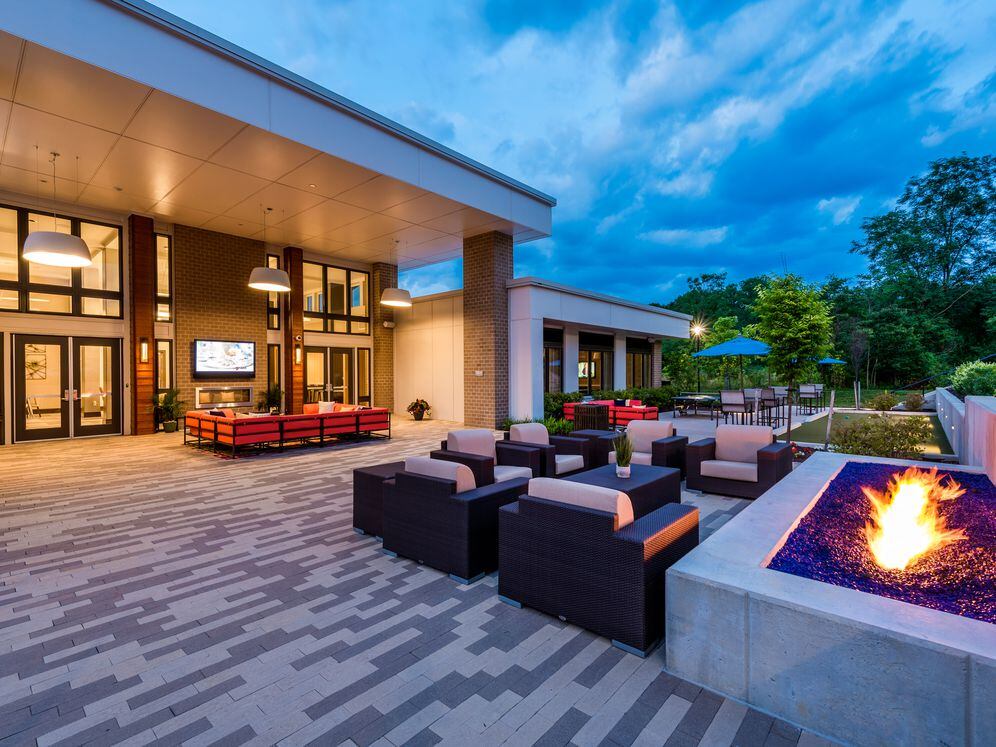 Courtyard with lounge seating, fireplace and flat screen television