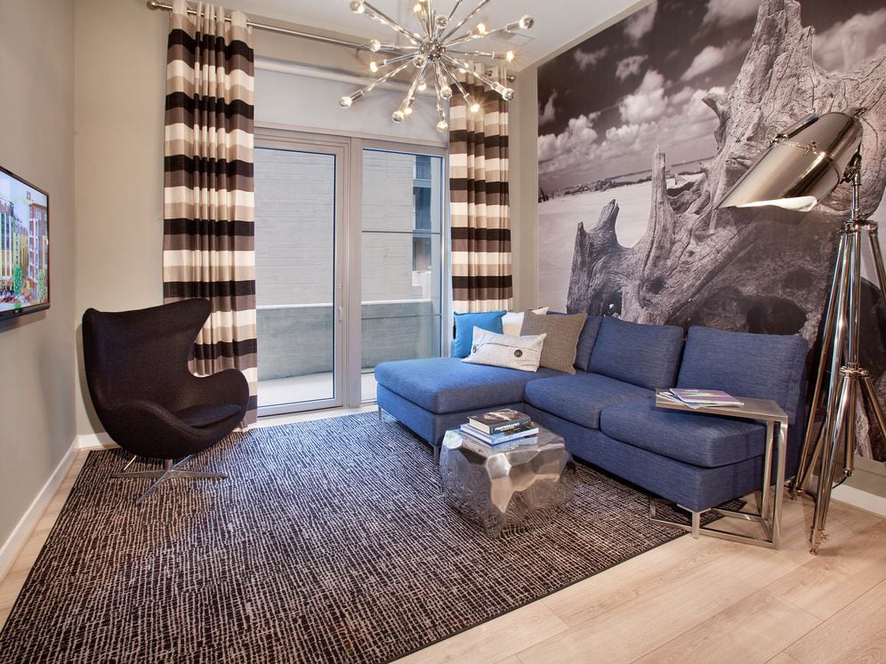 Living area with hard surface flooring and balcony