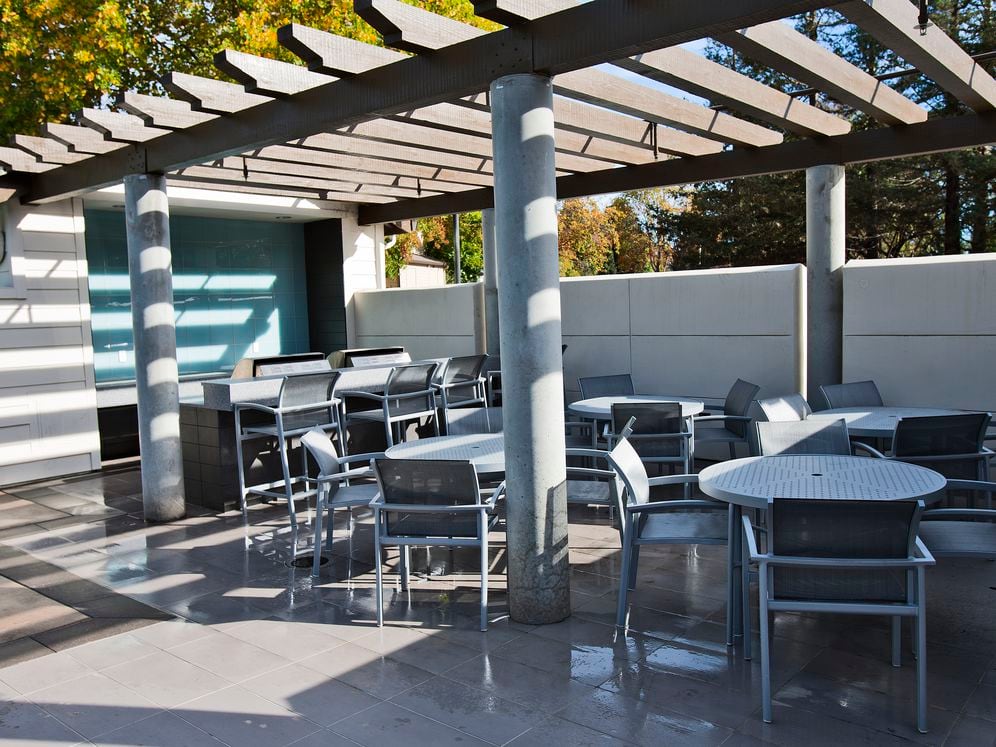 Outdoor lounge with barbecue grills and dining area