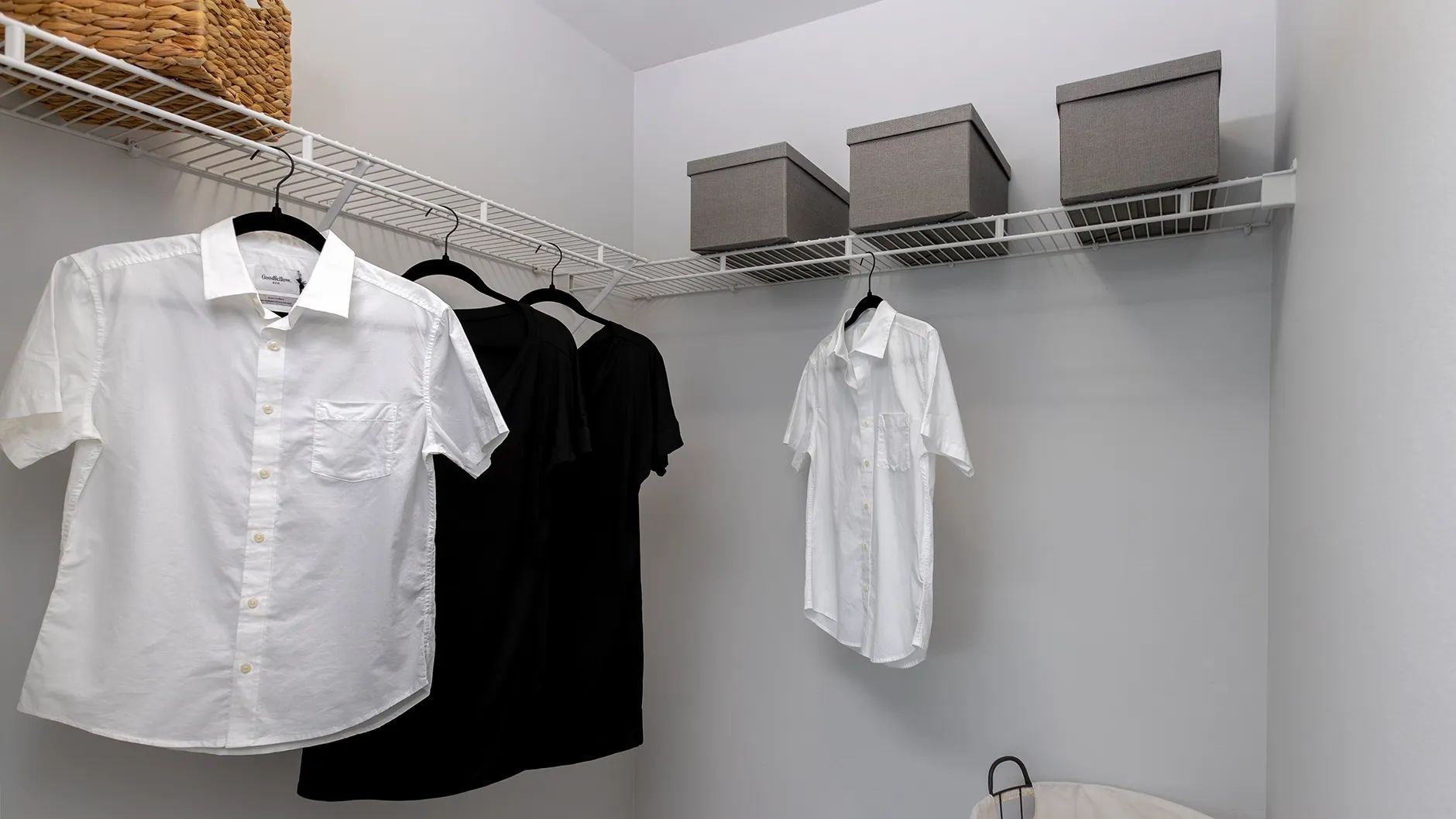 Step into the secondary bedroom's walk-in closet—a curated space for ultimate organization, boasting meticulously arranged shelves and ample storage solutions. 