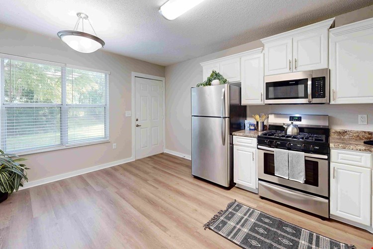 Revel in the incredible Jekyll kitchen that harmonizes functionality and style with a gorgeous picture window and full-size appliances.