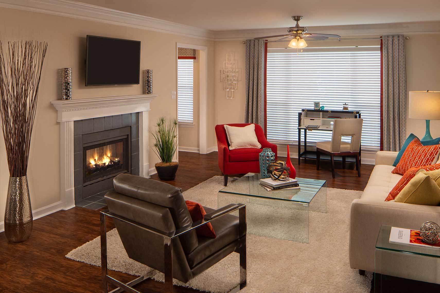 Beautiful Apartment with fireplace, wood style flooring and crown molding.