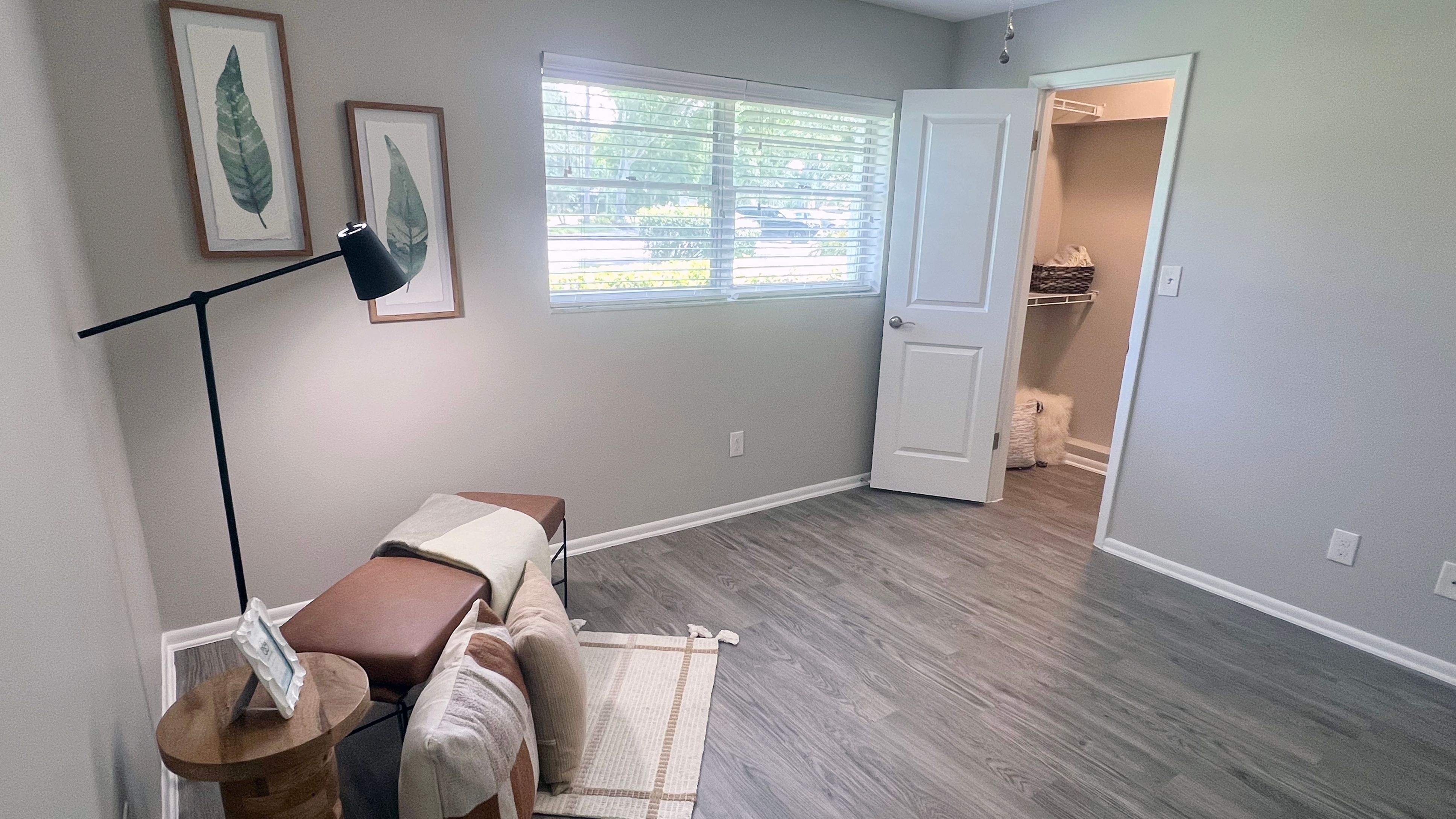 Spacious bedrooms featuring wood-style flooring, ample natural light, and a walk-in closet. This serene atmosphere is a perfect retreat for rest and relaxation.