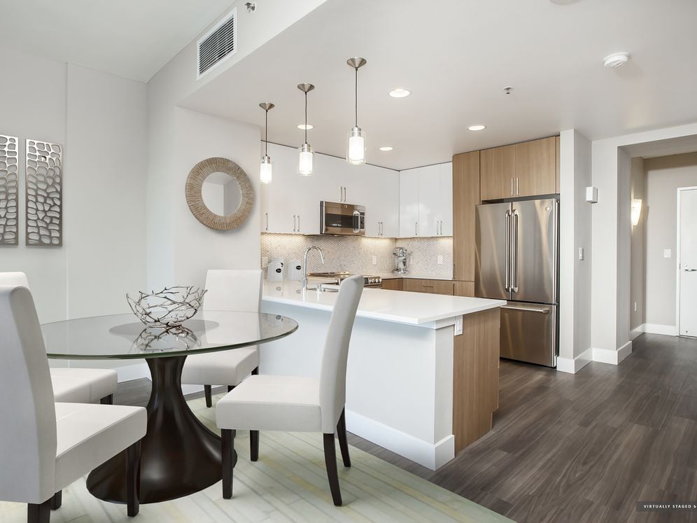 Signature Collection Dining and Kitchen Area with Hard Surface Vinyl Plank Flooring