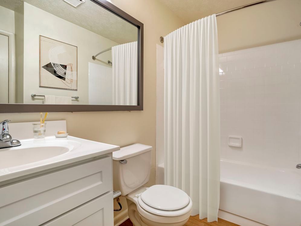 Upgraded Package II bath with white cabinetry and countertop