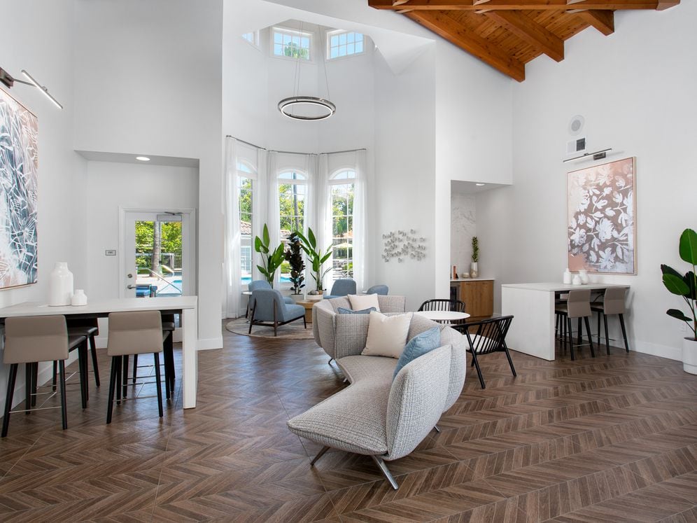 Resident lounge and leasing area with coworking spaces and lounge seating