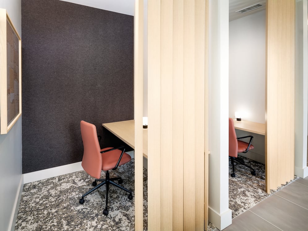 Cowork lounge with private work pods