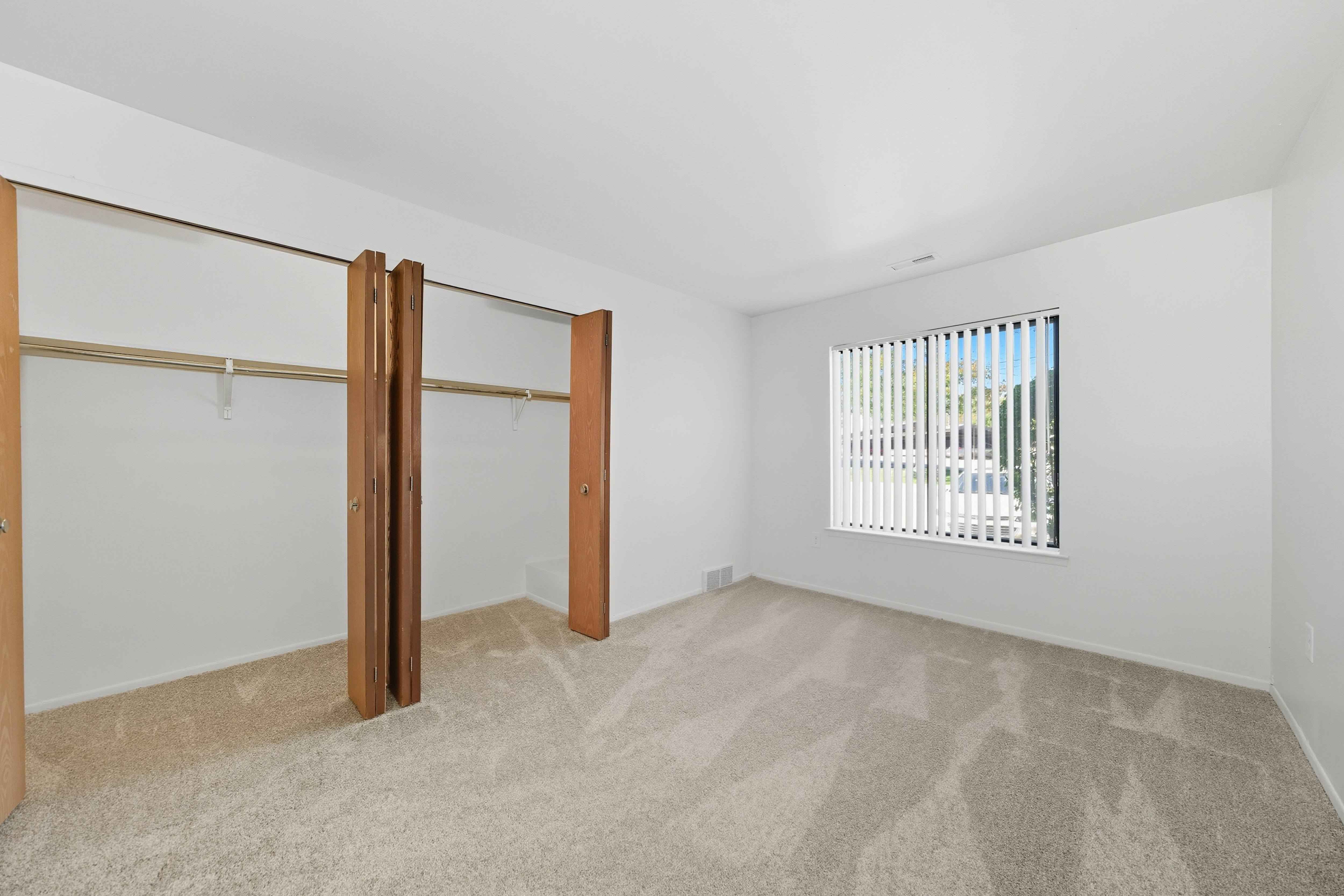 Comfortable Bedroom with natural light at Franklin River Apartments in Southfield, MI
