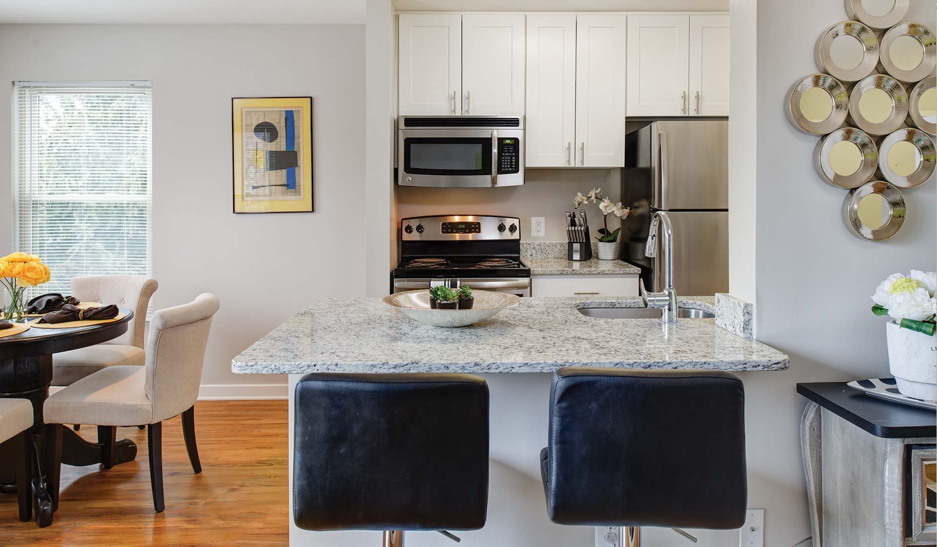 White Oak Premier kitchen features a designer kitchen and wood flooring