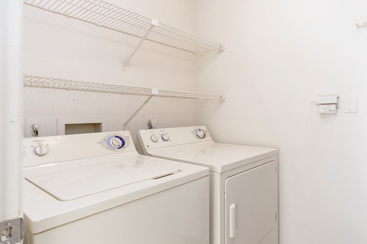 Laundry room with storage space 
