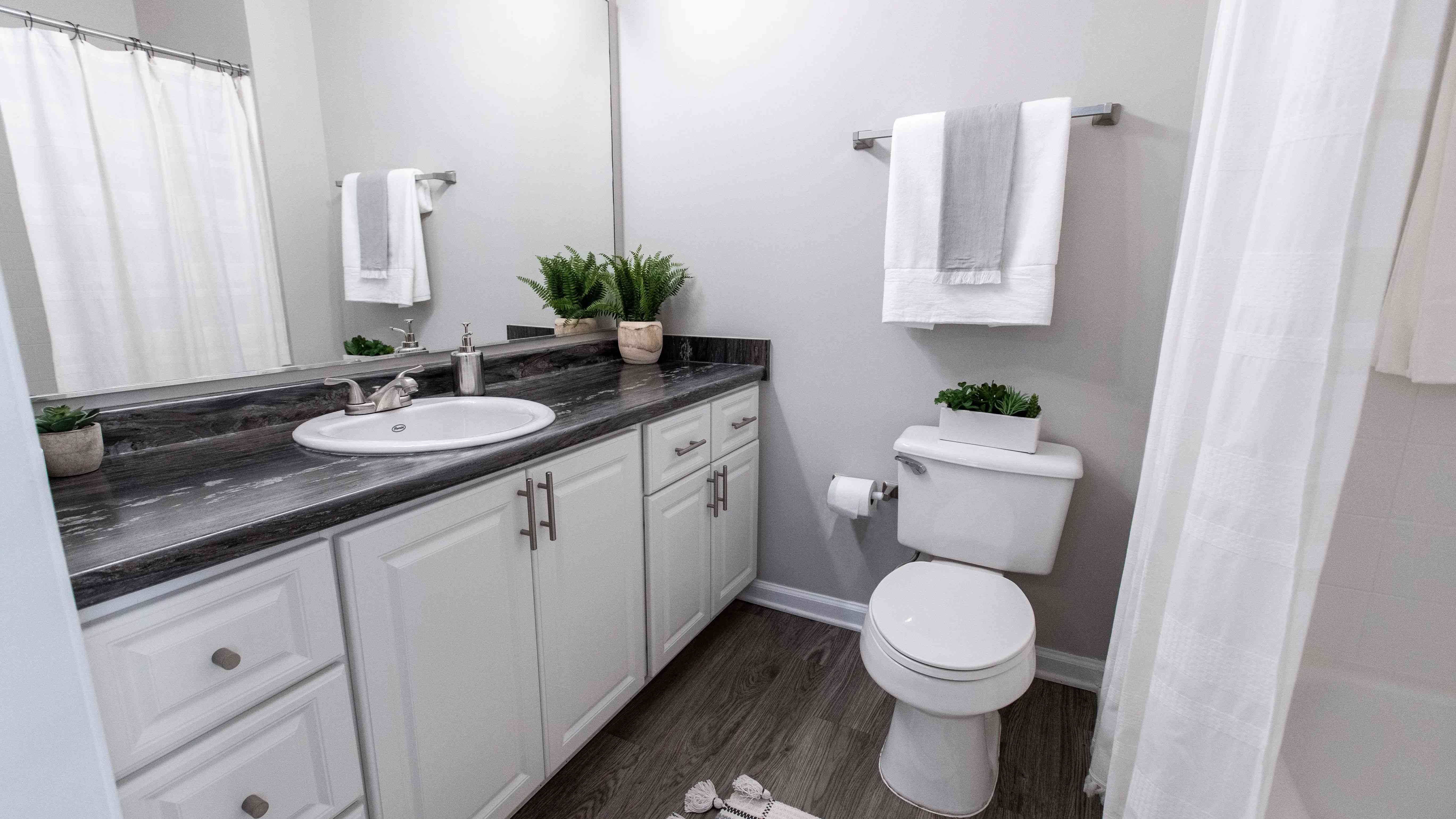 Pamper yourself with the master bathroom's oversized vanity and mirror.