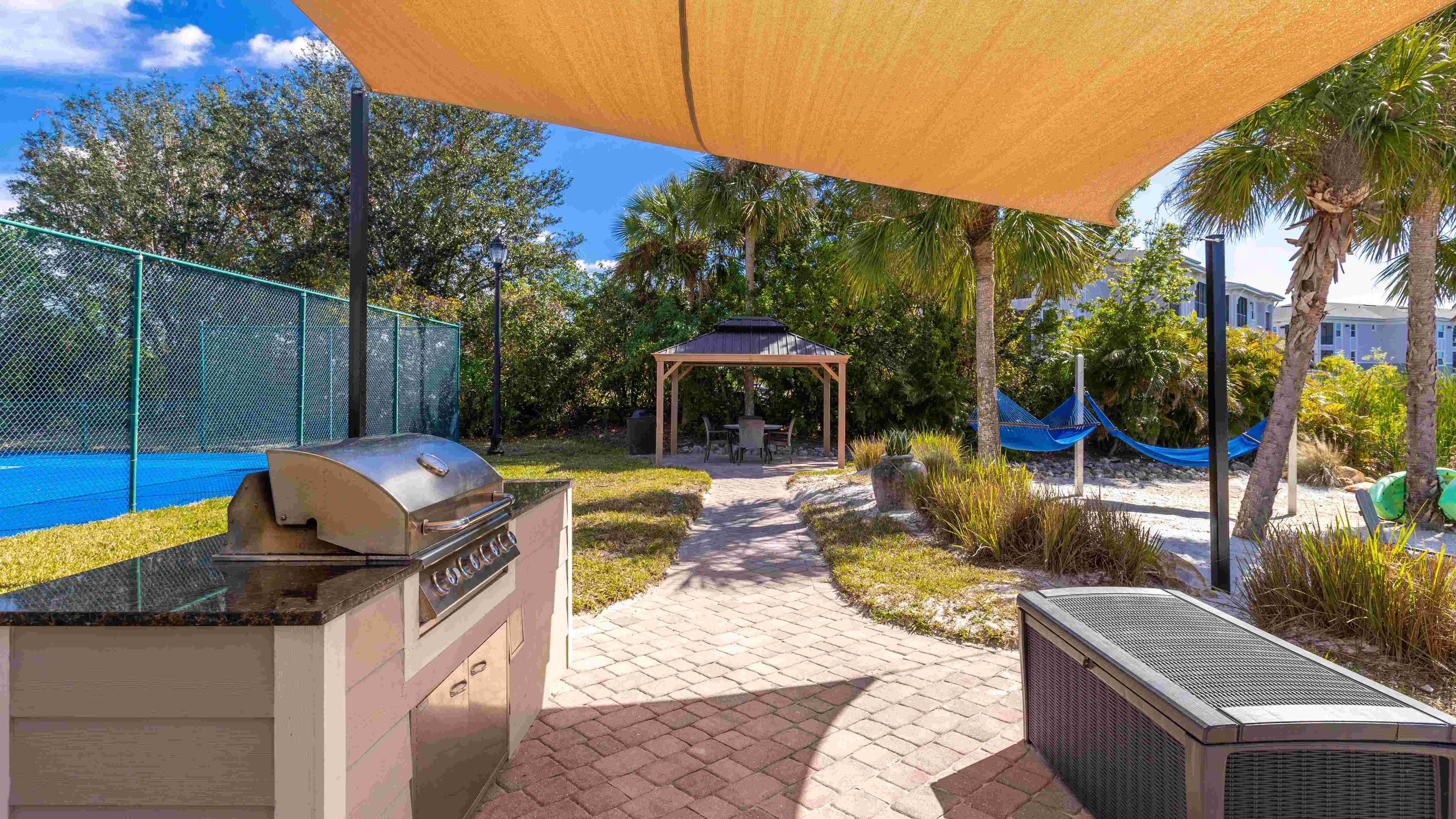 Fire up the grill and relax in the gazebo or hammocks, all surrounded by lush tropical landscaping.