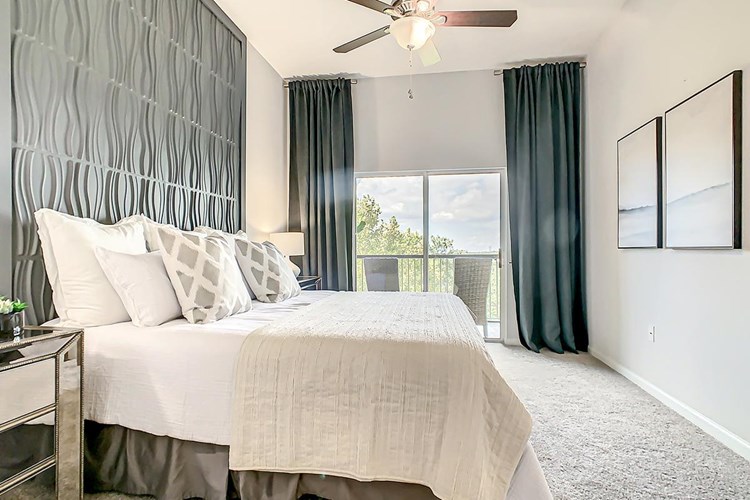 Master bedrooms featuring walk-in closets and sliders to private balcony/patio.