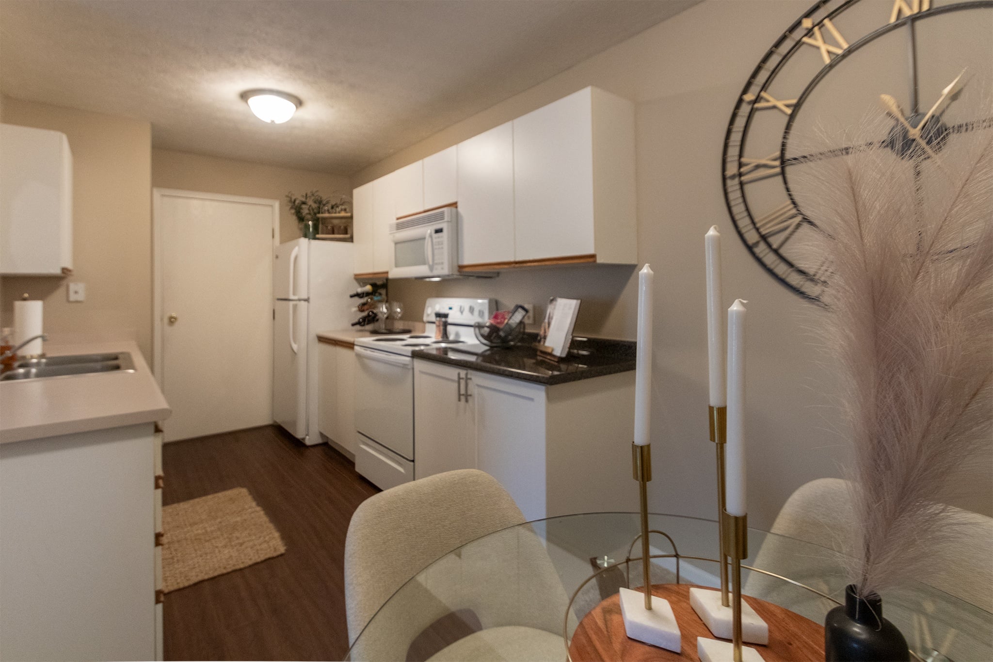 Our model Liberty kitchen features both upgraded cabinetry with dark countertops and classic cabinetry with light countertops.